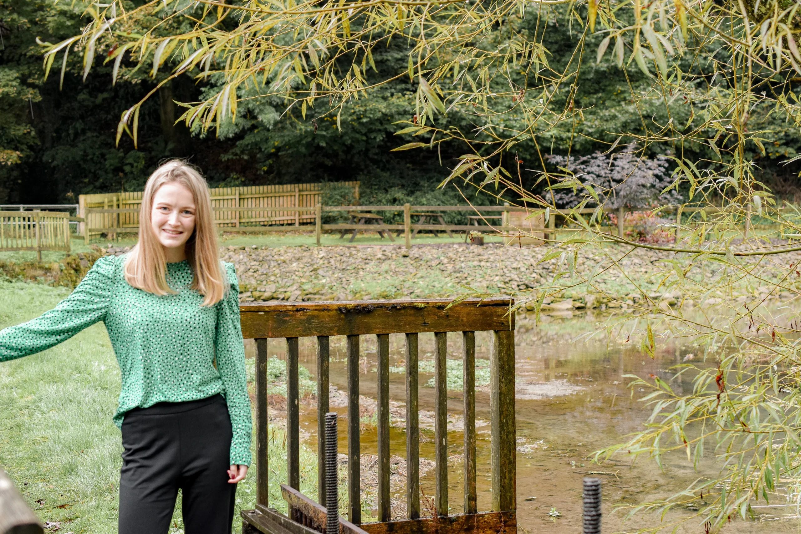 Maya, ethical Virtual Assistant standing on a bridge